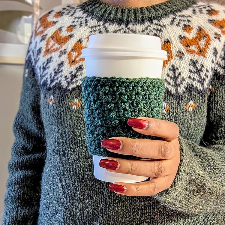 Holding Coffee Cup with Crochet Cozy
