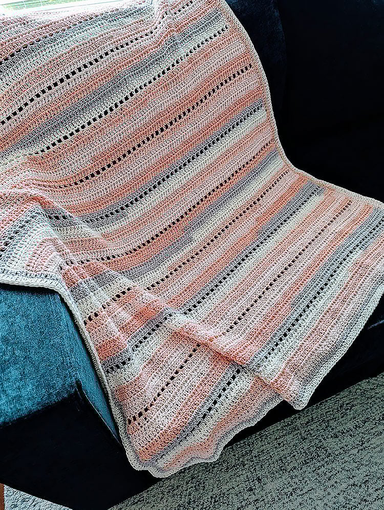 Pink Sands Summer Blanket on Couch